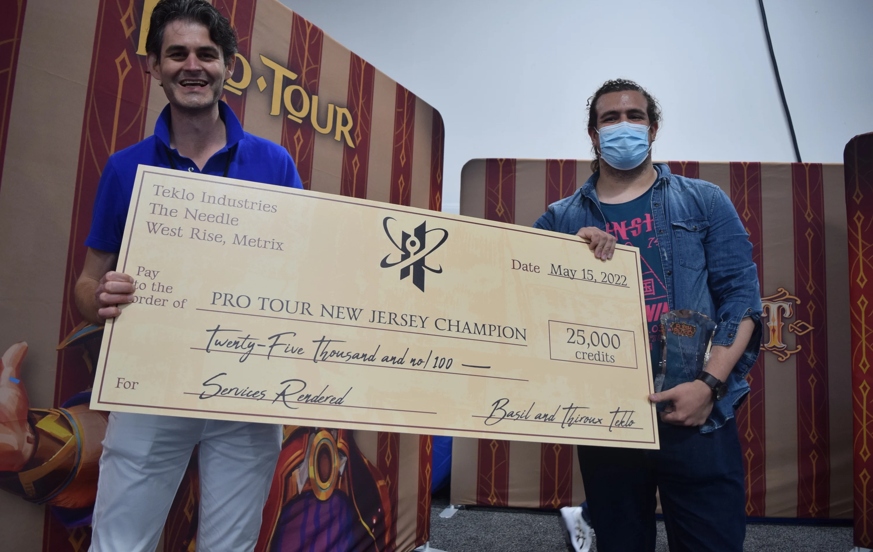 Pablo Pintor, Pro Tour Champion, receiving the prize check from James White