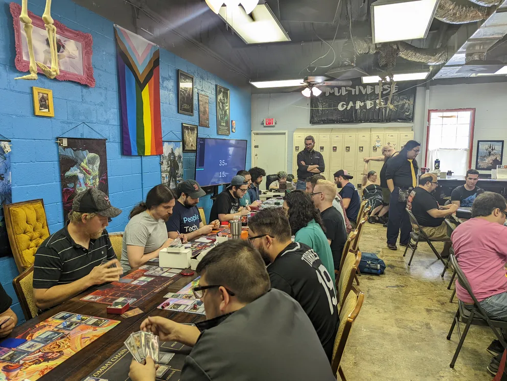 Non-yelow shirt Tournament Organizer looking over an event