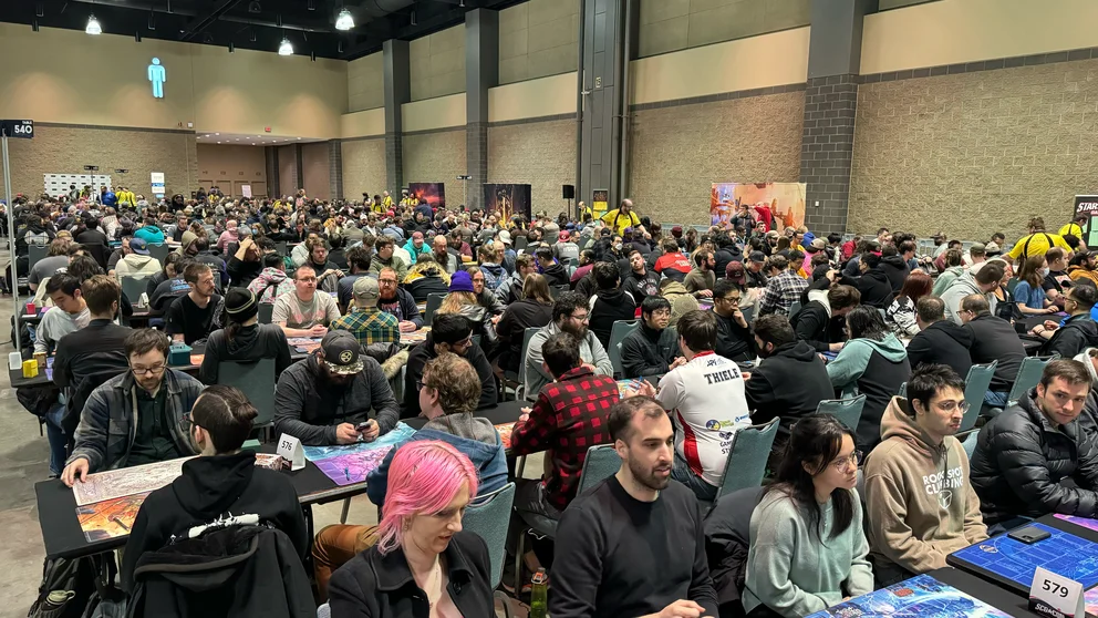 Players sitting down to build decks for The Calling